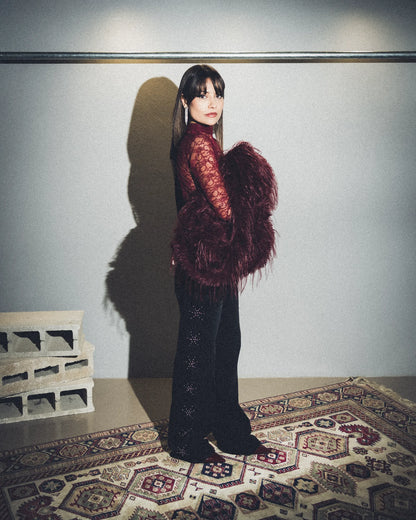 Jeans nero con borchie laterali argento