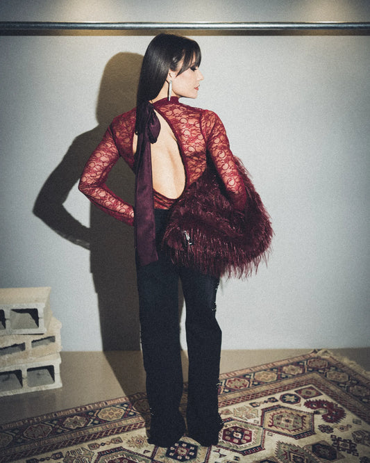 Jeans nero con borchie laterali argento